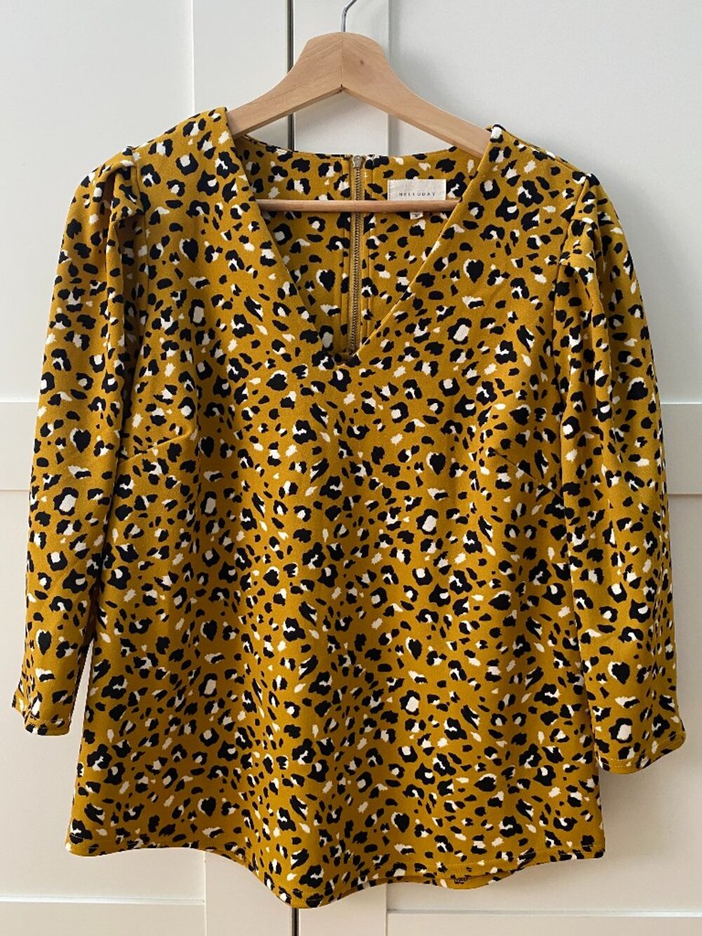 Melloday Leopard Print V-Neck Blouse in size Medium.